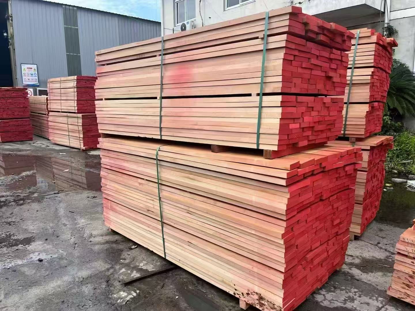 Stacks of kiln-dried lumber in warehouse